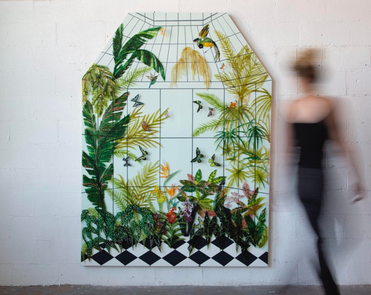 a patterned and floral wall artwork by Kate Clements made from kiln-fired glass