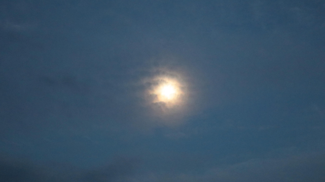 a raw photo of the supermoon in the evening