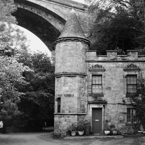 Yashica MAT124G | Cinestill BWXX 250 | Shot at 400 + Med Yellow Filter | Developed in XTOL

A small castle-looking building underneath a large stone bridge (Deans Bridge if I recall correctly).  Building is labeled “Millers Row”