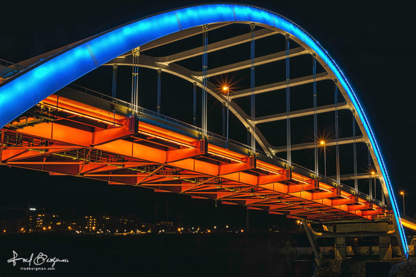 Blue and orange bright neon lights on the Gateway bridge in Nashville, Tennessee