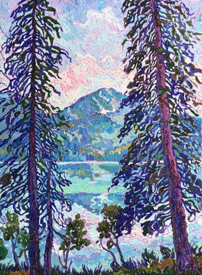 A scene, perhaps at sunrise with its touches of pink on the clouds, of two very tall and thin trees framing a distant mountain peak reflected in a mirror-like lake.