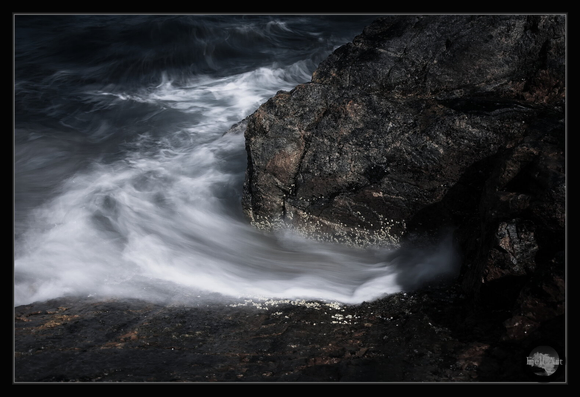 The motion. A water flowing around the stone.