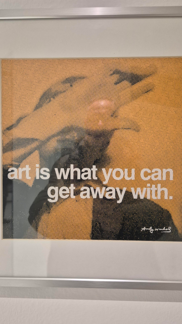 Bild im Bilderrahmen mit dem Zitat "art is what you can get away with" von Andy  Warhol.