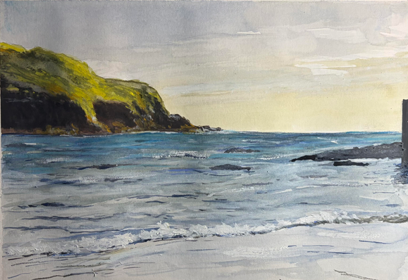 A watercolour painting of a headland caught by evening sun and a yellowy sky.there is a the edge of a breakwater to the right and some rocks. 