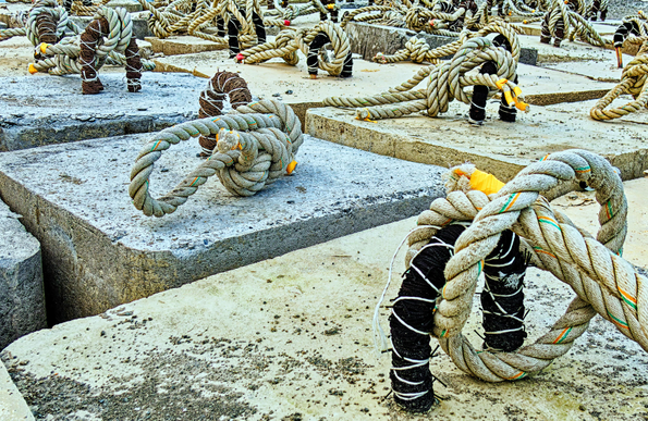 Large blocks of concrete with ropes attached.
