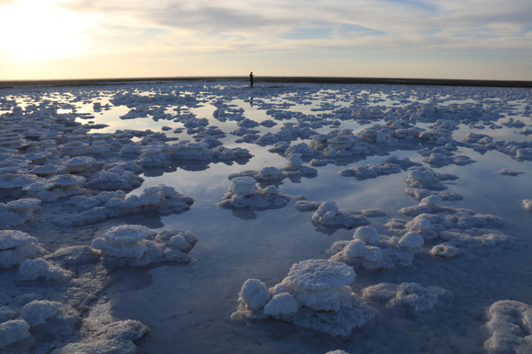 A man walks amid salt masses that have formed in Lake Tuz.
