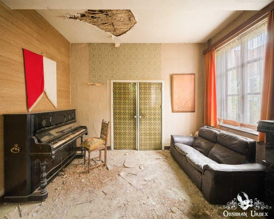 living room with sofa and upright piano