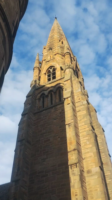 Video starts looking up a church spire to blue sky, then to ground level, panning over the churches of Holy Corner
