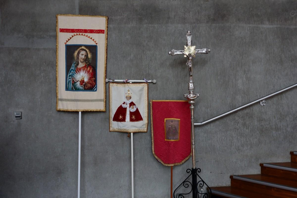 banners leaning on a church wall