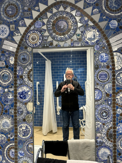 The ceramic wall of the gents 