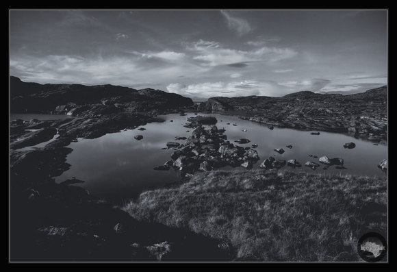Rocks, stones, water and sky. Selenium tone monochrome.