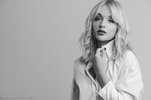 Black and white portrait, of Katey, blond, in a white blouse