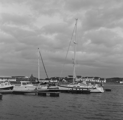 Yashica MAT124G | Kodak Tri-X 400 | Shot at 320 + Med Yellow Filter | Developed in XTOL

Sailboats moored in Port Ellen Harbor