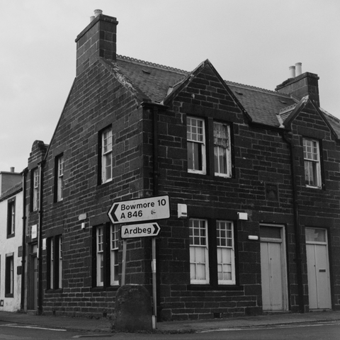 Yashica MAT124G | Kodak Tri-X 400 | Shot at 320 + Med Yellow Filter | Developed in XTOL

A house with a street sign in front of it pointing NW to Bowmore and NE to Ardbeg