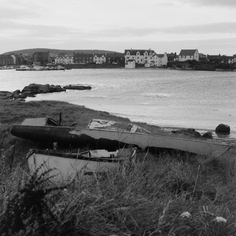 Yashica MAT124G | Kodak Tri-X 400 | Shot at 320 + Med Yellow Filter | Developed in XTOL

A view across the bay, houses in the background and a beached, dilapidated boat in the foreground