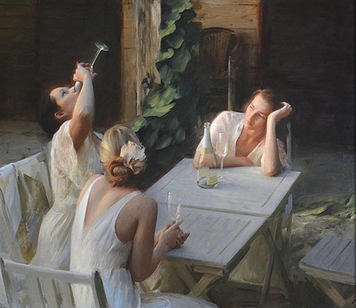 A group of three women in light dresses are seated around a table. One woman is drinking from a glass, while another appears contemplative, resting her head on her hand. The setting features greenery in the background, suggesting a tranquil outdoor atmosphere.