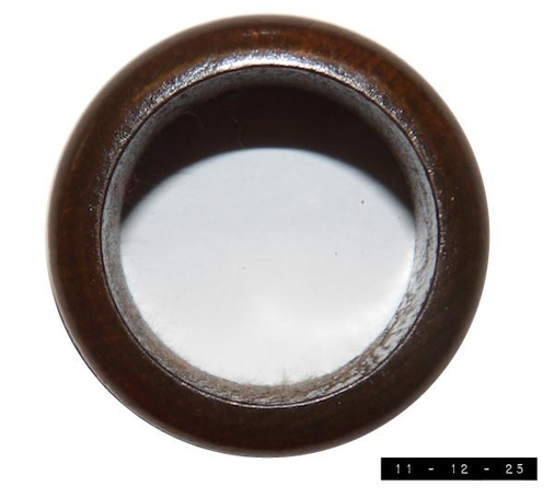 Thanksgiving!  Time to bring out my wooden napkin ring.  About an inch and three-quarters wide by an inch and an eighth deep, it's just the thing to add a touch of class to the traditional Flintstones paper napkin I carefully roll and place in it.  Someday I hope to buy more so that the other members of my family can experience the joy it brings me.  Until then, well...  they get first dibs on that thing called wine.          