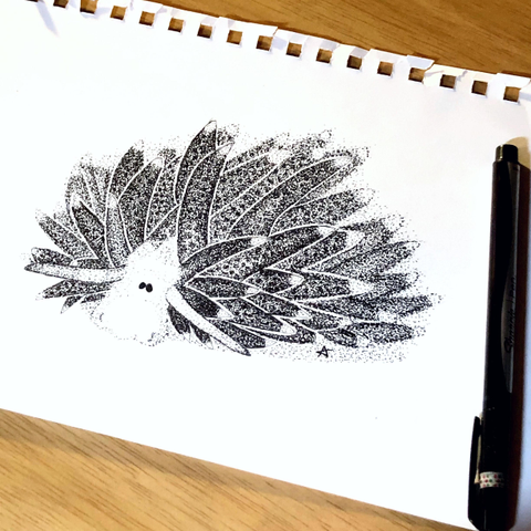 A black and white pen and ink stippled drawing of a leaf sheep, aka, Costasiella kuroshimae: A tiny sea critter with a white, adorable, sheep like face, with long purple horns extending out from either side. It’s body completely covered in long green leaf like spikes tipped in pale blue-purple,  softly waving in the water’s current 