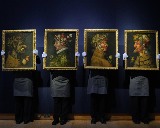 Christie's assistants hold The Four Seasons series.