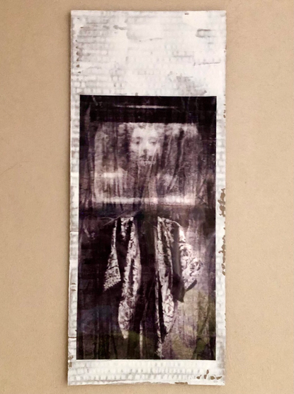 Digital collage of a dress and a human being on a painted cardboard 