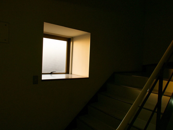 A stairwell in Gion, a hostel in Hirakata. Early morning light.