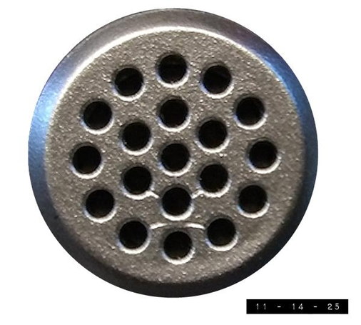 Close-up view of the microphone on the top of my sound level meter (Toptes model TS-501 B).  The buff metal microphone is about half an inch in diameter and gives every sound its choice of 19 holes to slip into.  I bought it last summer after buying a new forced air furnace/AC unit.  That unit was louder than expected.  How loud?  Well - thanks to this meter - I discovered that it was about 80 decibels in my central hallway where the cold air duct is, or about as loud as a truck.  Fortunately, a technician was able to reduce the blower speed enough to bring that down to  70 decibels - about the same loudness as city car traffic.  Not perfect, but better than it was.  And I only had to yell at the technician at about the loudness of a helicopter (100 decibels) before he understood what my problem was!  (I'd been prepared to go as loud as a 130 decibel jet engine even though my yodeling coach urged me to save that for the Christmas concert.)   