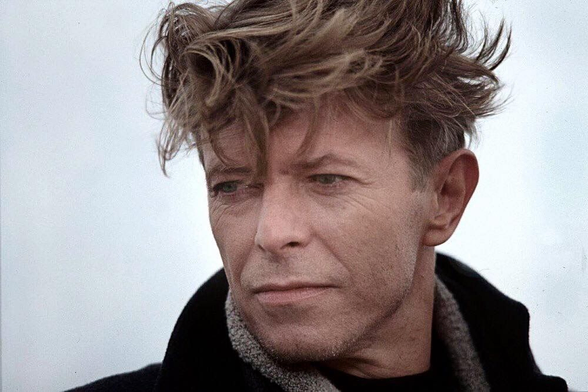 Robert G. Zuckerman took his beautiful, touching photograph of David Bowie in December 1990, Coney Island, NY. “One of my first still jobs on a film set, covering the final New York portion of the indie production The Linguini Incident. This portrait of David Bowie was made on a cold, grey, blustery December morning as he stood on the beach, in between cigarettes.”

