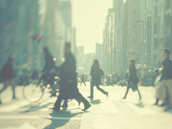 Standing on the Ginza Crossing looking due south. People crossing in the winter light. A specific plane of focus set with movements of the lens plane creates the effect. 

From a series I made back in 2011, called "Ghosts of Ginza". Shot with a Mamiya AFDii medium format camera, ZD digital back, 127mm Kodak lens from 1943 and a macro bellows converted into shooting infinity focus with tilt, shift and swing movements. 