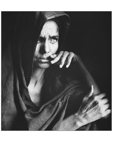 BW portait of a woman with covered head.