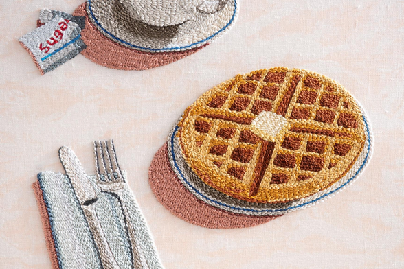 an embroidery of waffles and silverware by Adrienna Matzeg