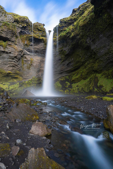 Kvernufoss Waterfall and Stream – Iceland’s Hidden Gorge Treasure

This peaceful view of Kvernufoss reveals the waterfall in all its elegance, framed by steep volcanic cliffs and glowing moss-covered walls. The long-exposure stream in the foreground leads the eye directly to the 30-meter cascade, creating a perfect blend of motion, texture, and tranquility. Soft light filters through the narrow gorge, highlighting the vibrant greens and rugged rock formations that make this hidden canyon feel like a sanctuary of untouched beauty.

Kvernufoss is one of Iceland’s quiet treasures, tucked inside a narrow mossy gorge just beyond the well-known Skógafoss. Fed by the Kverna River, the falls plunge into a sheltered basin surrounded by ancient cliffs shaped by time and weather. The short hike to this secluded spot feels like discovering a secret world, where the only sounds are flowing water and the soft breeze moving across the canyon.

This image captures the serene, intimate side of Kvernufoss and the sense of wonder that comes from standing before one of Iceland’s most beautiful hidden waterfalls.

Image:
https://fineartamerica.com/featured/kvernufoss-waterfall-and-stream-icelands-hidden-gorge-treasure-wayne-moran.html

Read more:
https://waynemoranphotography.com/blog/chasing-light-across-iceland-our-21-day-adventure/

#Kvernufoss #Waterfall #Iceland #nature #travelPHotogrpahy #Landscape #art #fineart 

#ayearforart #buyintoart
