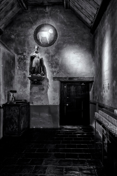 Votive candle area, facing door to outside.