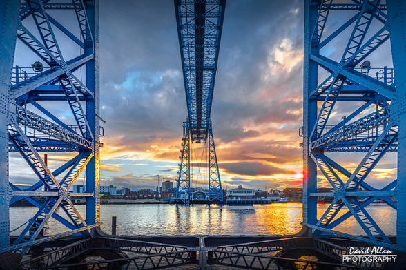 The Teesside Transporter Bridge across the River Tees in Middlesbrough, NE England. The iconic landmark, captured here at sunset, currently faces an uncertain future. Closed since 2019, it was this year added to Historic England's Heritage at Risk register.