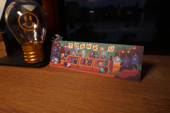 A picture of the "Thank U" sign, that was within the box.