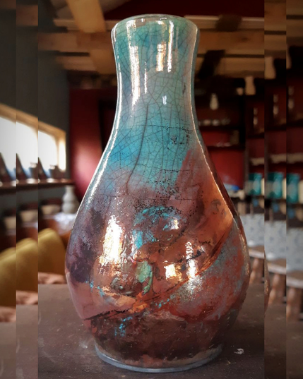 Turquoise and copper raku vase.
