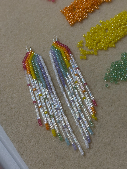 A pair of beaded fringe earrings in rainbow colors