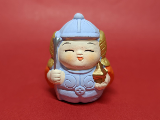 Omikuji (fortune slip) holder in the shape of the god Bishamonten.