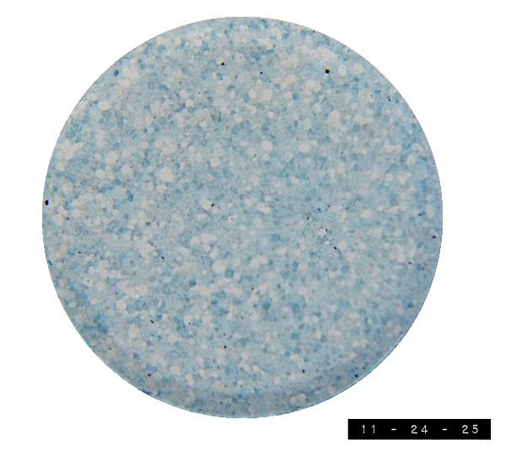 Regional store brand knock-off version of a Polident denture cleaning tablet.  It's about three-quarters of an inch in diameter and sports a random blue and white speckled pattern.  I don't use these myself but I like to keep some on hand in case I get a few elderly trick-or-treaters on Halloween who aren't interested in candy.  The bad news is I forgot to turn my porch light on this Halloween so no one came to my door.  The good news is that these tablets will probably keep until next Halloween unless I learn they make great Fourth of July sparklers when glued onto a stick and ignited.    