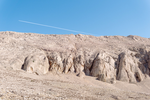 Gray mountains composed of limestone rocks.