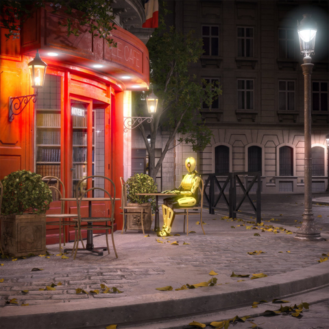 A golden/yellow robot sits on a chair in a nighttime European street scene with historic architecture and warm lighting