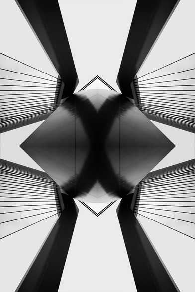 A black and white abstract symmetrical architecture shot of a bridge.
