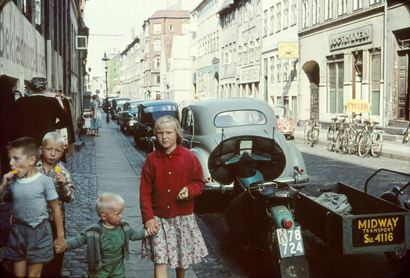 A colour 35mm slide showing some children eating popsicles next to a vehicle labled Midway Transport