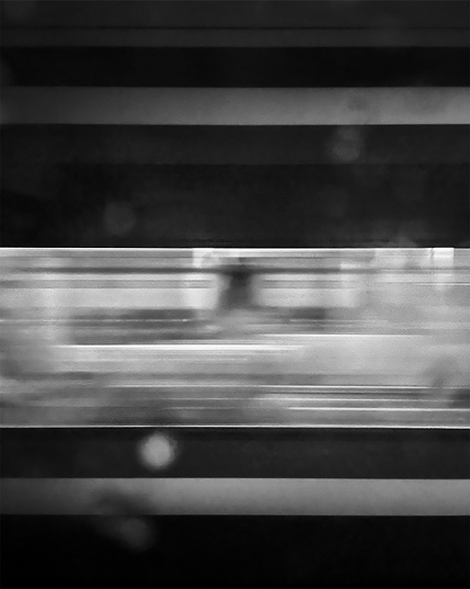 Abstract black and white image of a passing train as blurred horizontal lines, suggesting high speed and dynamic movement, with soft gradients and focus.
