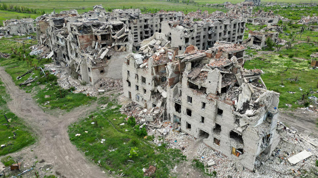 A drone view shows the ruins of residential buildings in the abandoned town of Marinka, in the Donetsk region.