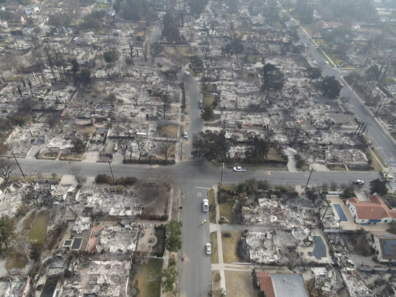 A drone views show the extent of the damage of a neighborhood block at the Eaton Fire in Altadena, California