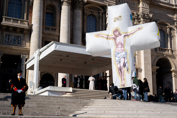 Pope Leo XIV receives an inflatable crucifix.