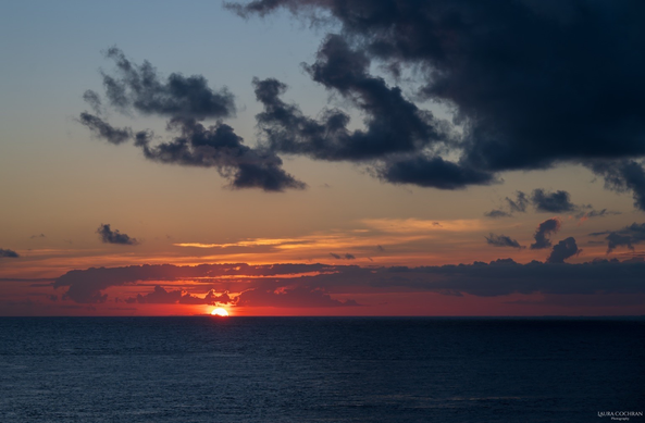 A glowing sunset over the sea. 