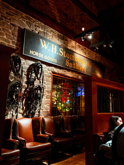 Decorative wall in Clyde’s Restaurant main dining room, with Christmas wreath in window. 

#Photography
