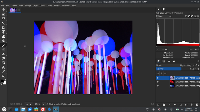 The image is a screenshot of a digital art program, likely GIMP, displaying a vibrant, abstract composition of glowing cylindrical shapes. The composition features numerous vertical, illuminated cylinders in a wide range of colors, including blues, purples, pinks, and reds, creating a tunnel-like effect. The cylinders appear to be arranged in overlapping layers, with varying brightness levels and sizes. A histogram is visible on the right side of the screen, displaying color distribution.