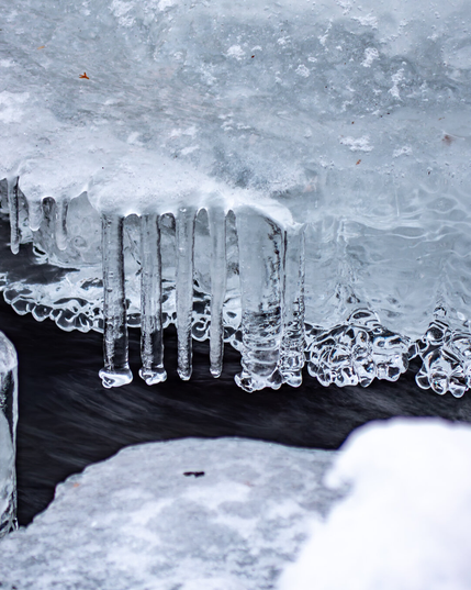 Icicles forming over water